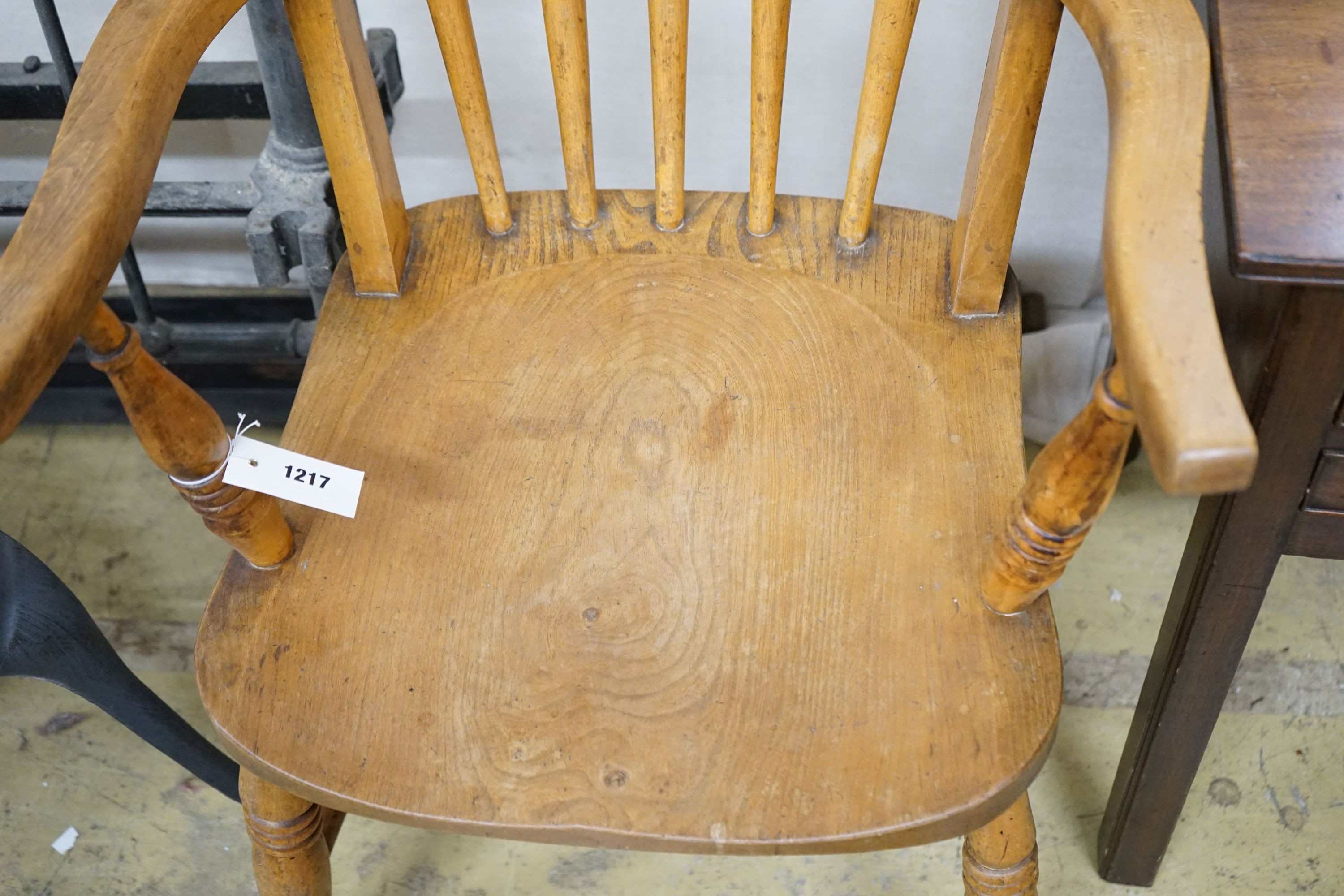 A pair of late Victorian elm and beech Windsor comb back armchairs, width 56cm, depth 47cm, height 112cm